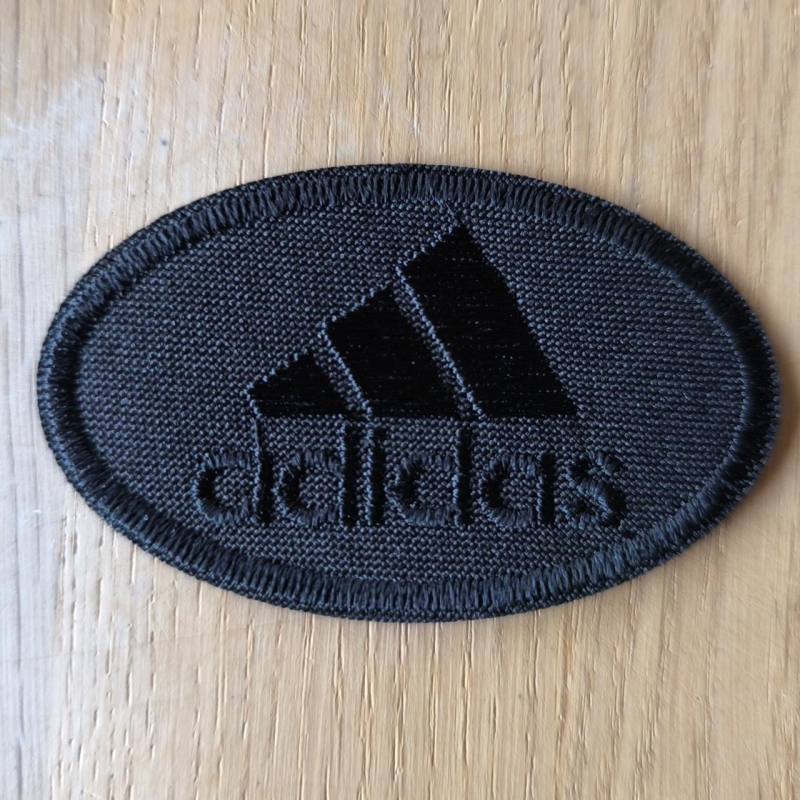 Аплікація для одягу спортивна. Овальна чорна. Adidas.