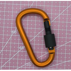 Карабін металевий жовтогарячий.