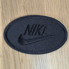 Аплікація для одягу спортивна. Овальна чорна. Nike.
