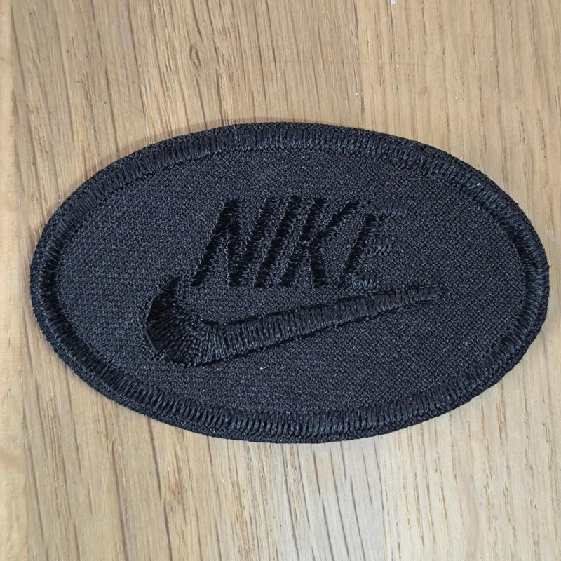 Аплікація для одягу спортивна. Овальна чорна. Nike. Аплікація для одягу спортивна. Овальна чорна. Nike.